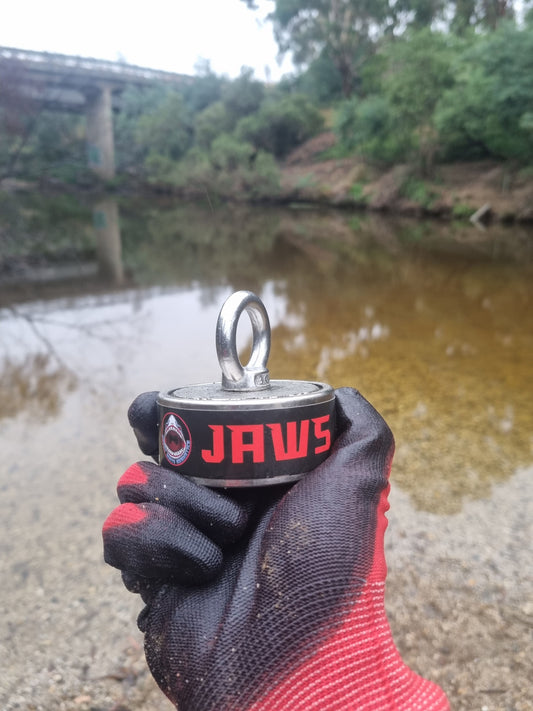 Magnet fishing in Australia under a bridge with a double sided magnet